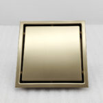 AQUADOM OCEANIC  6"x6" Square Shower Drain Tile-In, with hair strainer, Marine-Grade 316 stainless steel in Brushed Gold